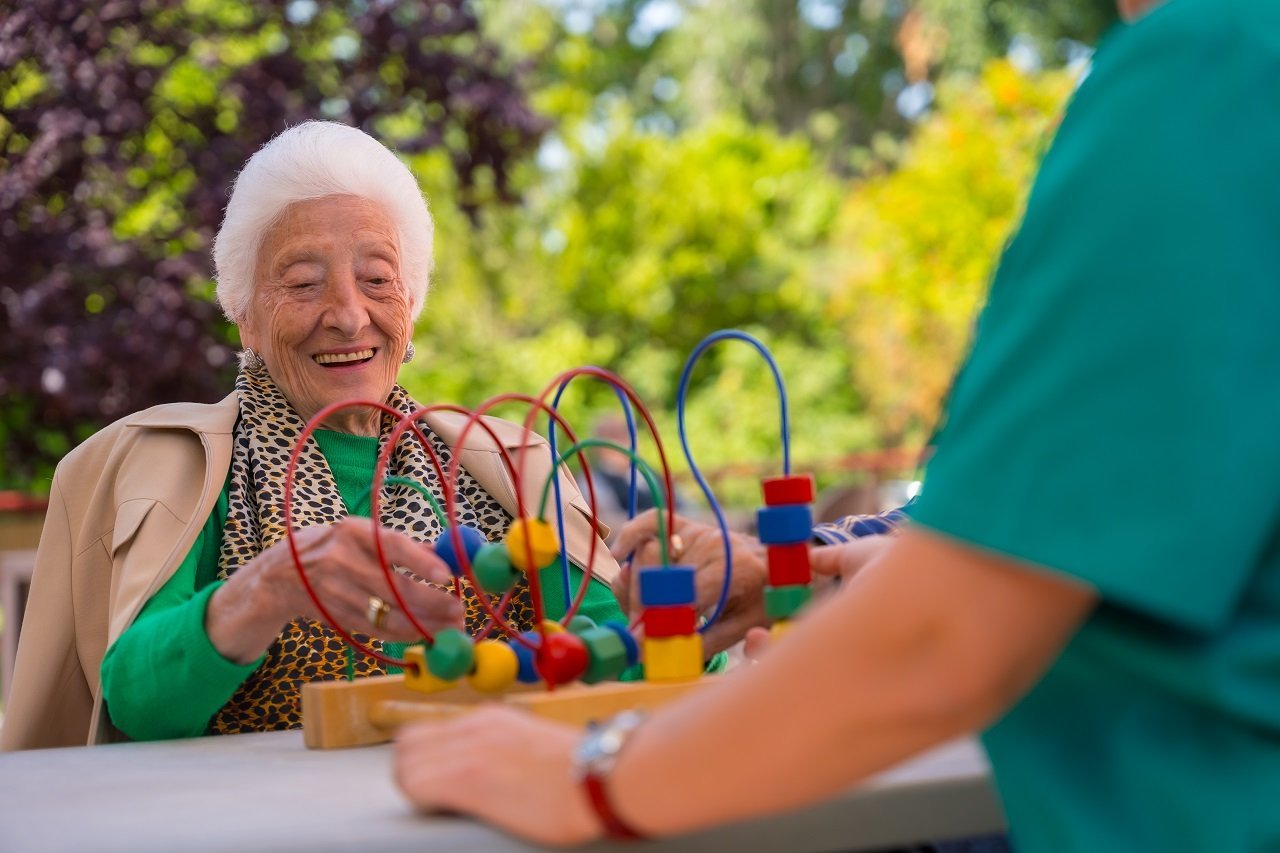 hand-of-an-elderly-woman-in-the-garden-of-a-nursin-2024-12-09-04-55-36-utc.jpg