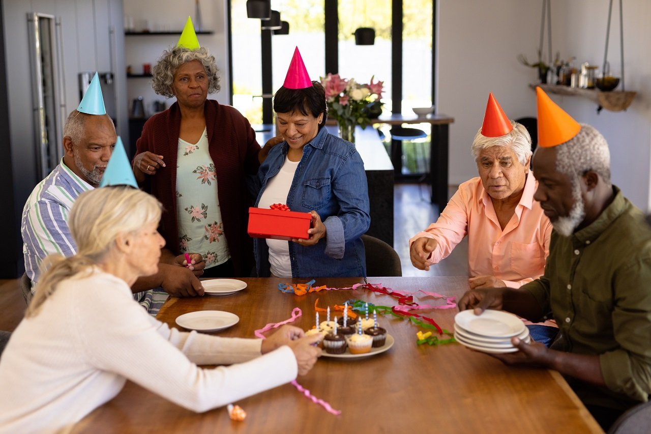 multiracial-senior-friends-wearing-party-hats-doin-2023-11-27-05-18-43-utc.jpg